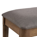 ACTU 823 Dining Bench; Walnut; close-up of gray upholstery texture and rounded seat corner