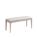 ACTU 823 Dining Bench; White Wash; angled view of upholstered seat and tapered legs