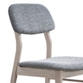 ACTU 826 Upholstered Dining Chairs; White Wash; front close-up of upholstered backrest and curved supports