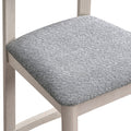 ACTU 827 Dining Chairs; White Wash; close-up of gray textured seat upholstery and frame