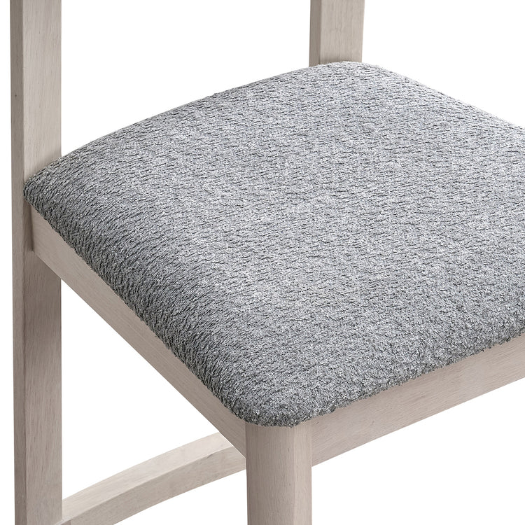 ACTU 827 Dining Chairs; White Wash; close-up of gray textured seat upholstery and frame