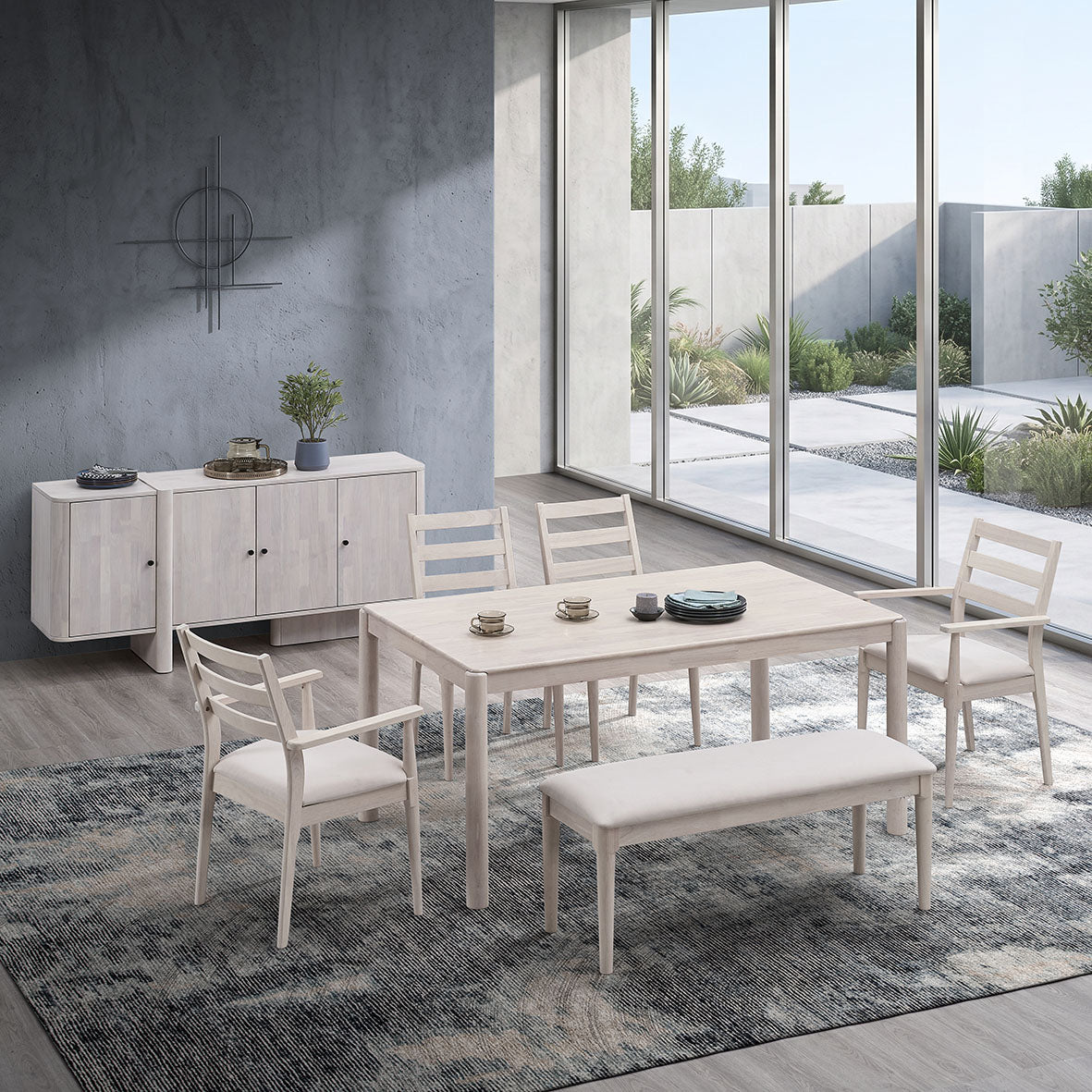 White Wash Emerson 823 dining table with four chairs, upholstered bench and Rovann 907 sideboard in a light-filled room