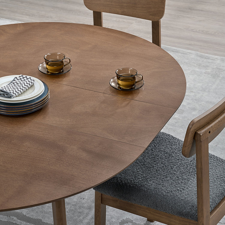ACTU 827 Round Extendable Dining Set, 4 Chairs; Walnut; close-up of extended tabletop and center-leaf seams