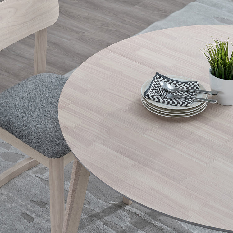ACTU 827 Round Extendable Dining Set, 4 Chairs; White Wash; close-up of curved tabletop edge and wood-grain finish