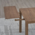 ACTU 831 Extendable Dining Table; Walnut; close-up of end extension leaf and exposed support rails; chairs not included