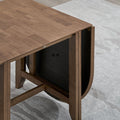 ACTU 825 Oval Drop-Leaf Dining Table; Walnut; close-up of folded drop leaf and supporting frame; chairs not included
