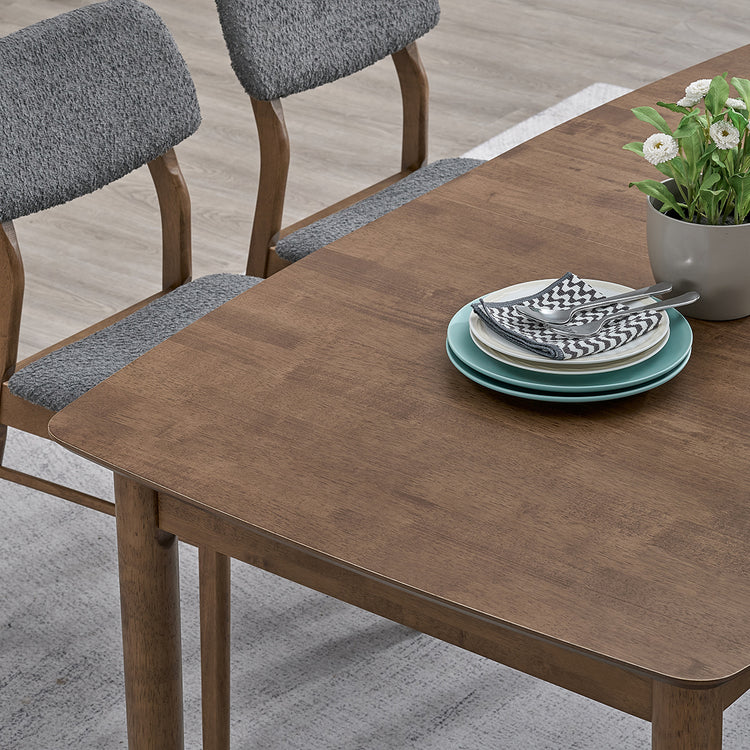 ACTU 826 Double-Extension Butterfly Dining Table; Walnut; close-up of tabletop wood grain and rounded corner; chairs not included