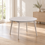 ACTU Parker 827 White Wash dining table in its closed round configuration, shown in an AI-assisted dining room scene; table only, accessories not included.