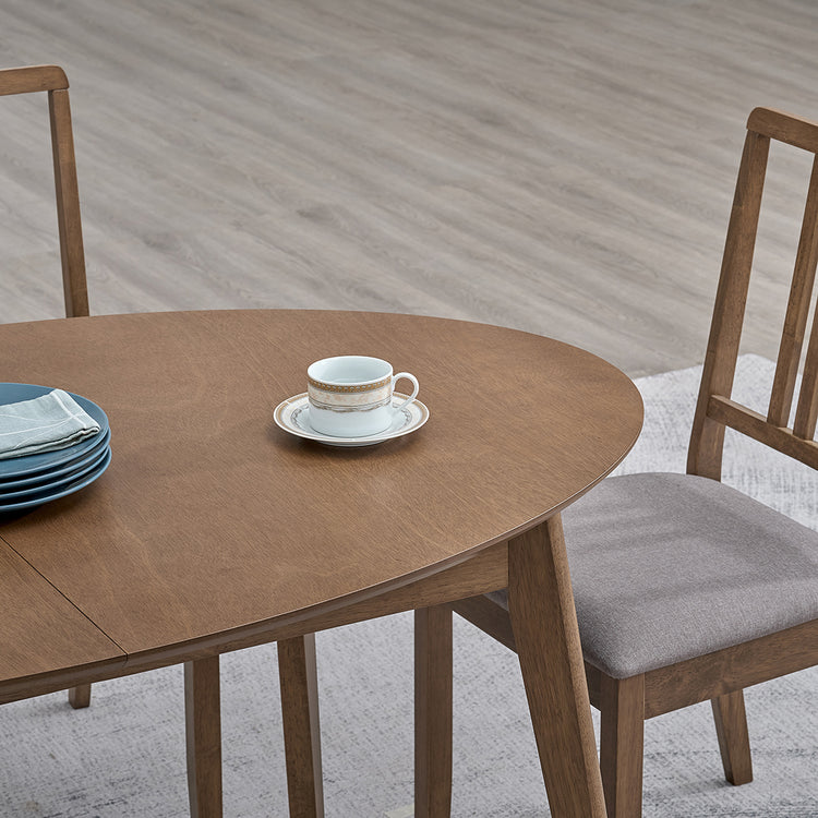 ACTU 828 Oval Extendable Dining Table; Walnut; close-up of oval tabletop edge and extension seam; chairs not included