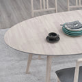 ACTU 828 Oval Extendable Dining Table; White Wash; close-up of oval tabletop and wood-grain finish; chairs not included